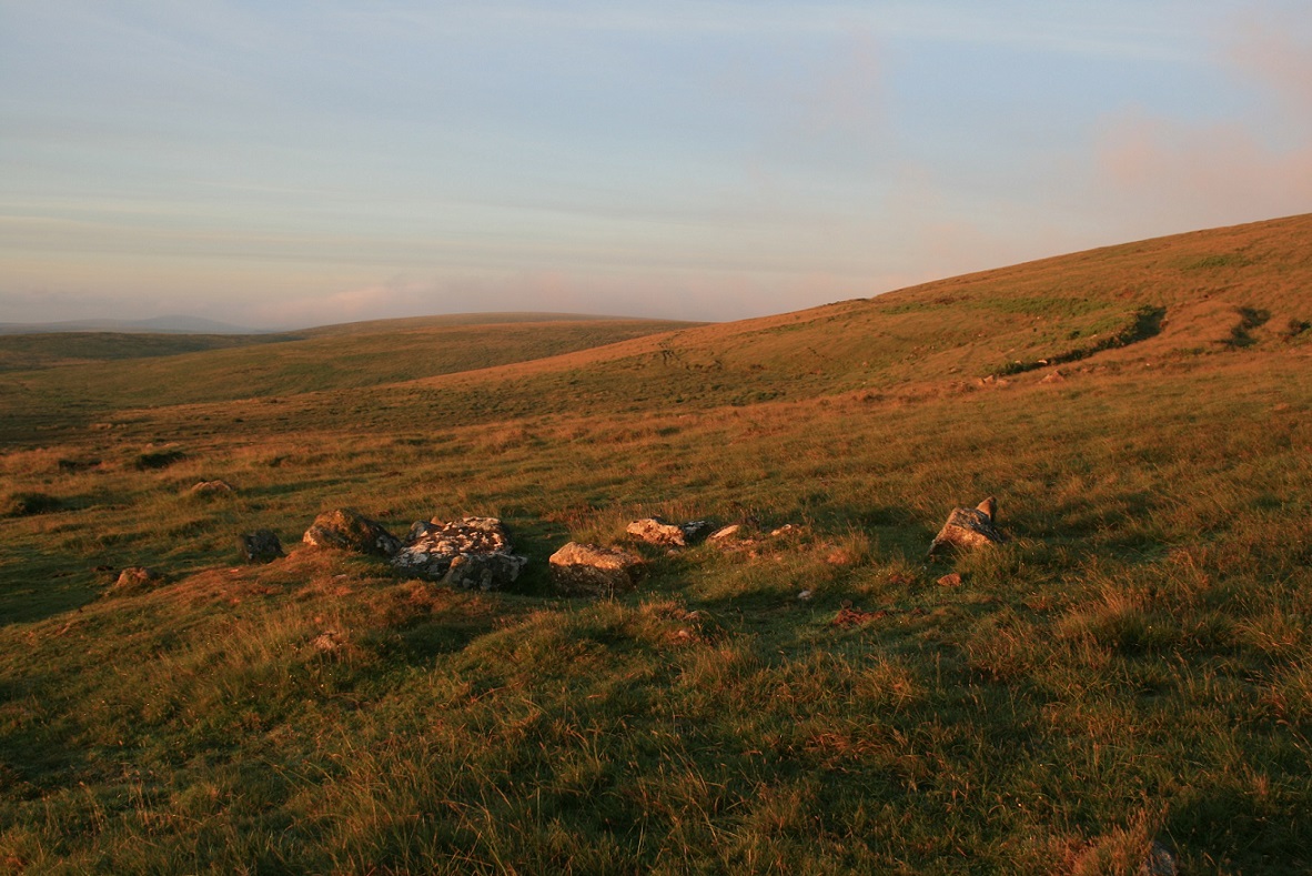 The cairn circle bathed in the glow of a summer solstice sunrise.