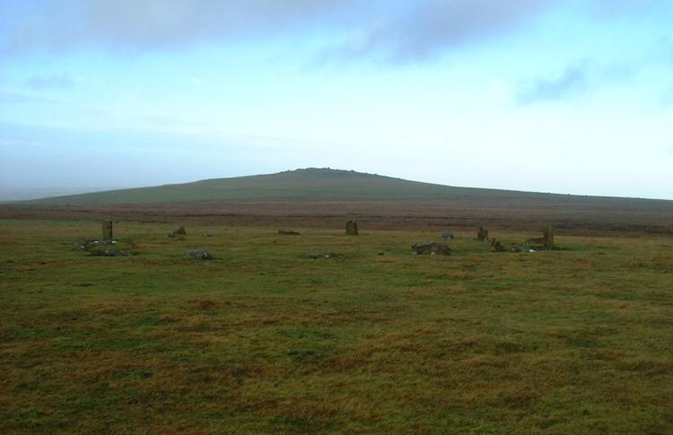 Langstone Moor Stone Circle. 

Beautiffully situated high on the open moor with clear views in all directions. Badly wrecked when used as target practice by troops 
training for the Normandy landings. Only 4 stones now remain standing out of a possible 16.

Seen here looking west towards White Tor
