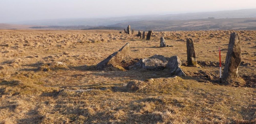 Kerbed cairn standing beside the stone row. View from north.