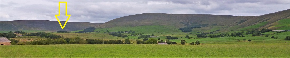 Taken from Oakenclough Road north of Beacon Fell, the arrow indicates the position of the circle on what can from here be seen to be the highest ground to the west of the west-facing semi-circle of much higher ground, *and* also between the valleys in front of, and behind the circle (in this view), both of which are formed by two identically named branches of the headwaters of the River Brock (and