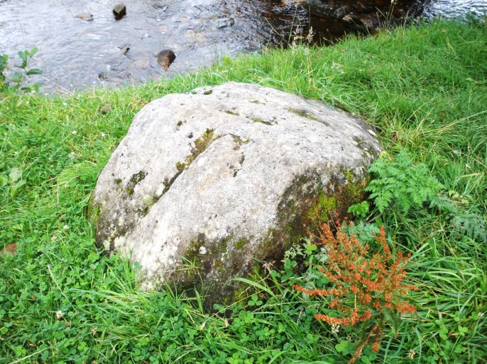 The glacial erratic boulder beside the pack-horse bridge at Wycoller. This was deposited here thousands of years ago by a melting glacial flow.