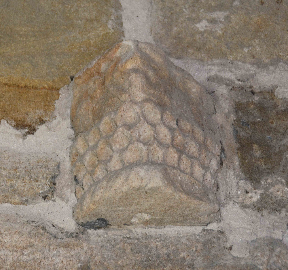 This unusual fragment is built into the southern end of the east wall, near the altar (inside).  It has been interpreted as 