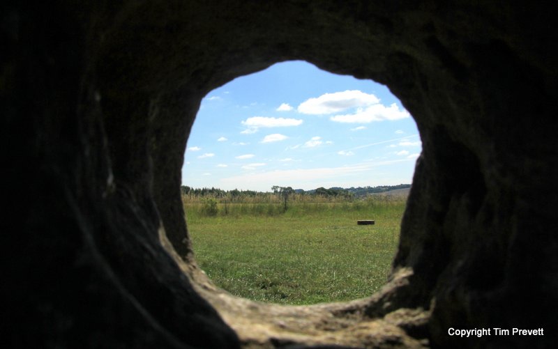 08/07/17 Obligatory shot through one of the holed stones pointing SE towards The Whispering Knights.