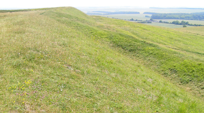 Uffington Castle southern ramparts and defensive ditch.