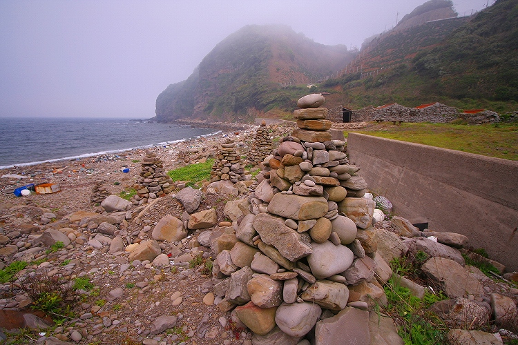 

Site in Kyushu Japan

People on Tsushima island still pile cairns every year, this is one of 2, at the shore of  Kisaka (木坂) hamlet 34.46421N,129.27850E
