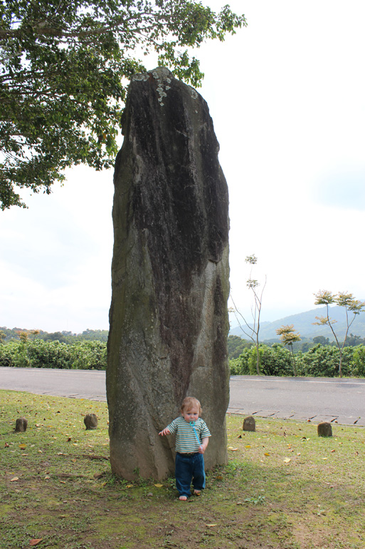 The smaller of the two stones, in comparison with my little son.