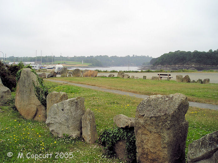 I remember this as a pleasant grassy park from my previous visit many years ago, having sailed to Trégier, but when I revisited in 2005, apart from the grass within it, it is in a massive dusty car and bus park, looking very unloved. 
Its a shame. 