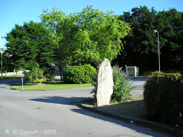 The two metre tall Tréboul menhir is found in the outskirts of the town of Douarnenez, beside a roundabout near to the old lavoirs. 
 