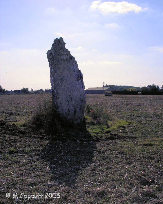 In the same field as the dolmens, the four metres tall limestone Nivardière menhir can be found before you reach the quarry. 

View looking west, with the main dolmen beyond.