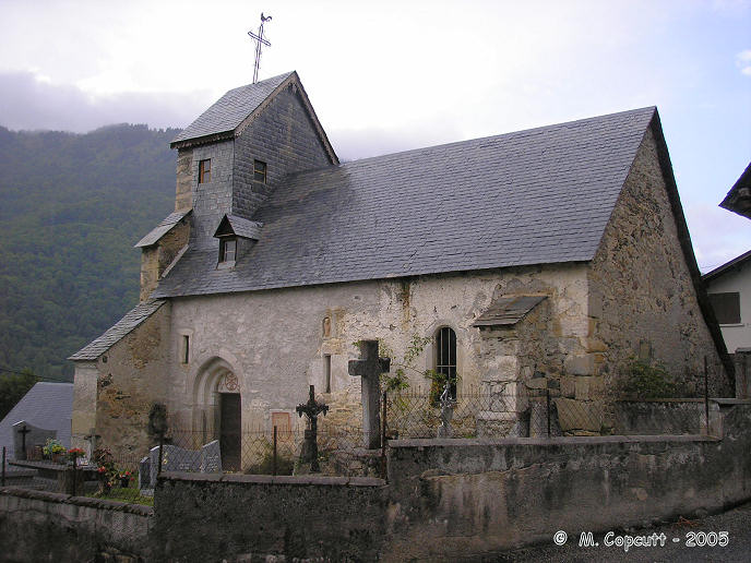 Deep into the Louron valley, on the western side of the Col de Peyresourde in the high Pyrenees, is the ancient village of Aneran. 

Within the tiny churchyard beside the small and ancient church are several odds and ends of old stone, some carved into shapes and and with patterns on them. The church also has some fascinating carved stones built into its walls.

The prehistoric stone here is t