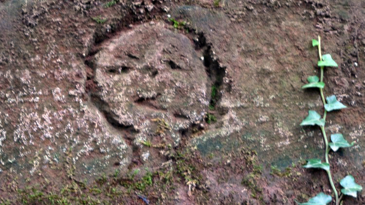 other human faces on the rock of the ancient site