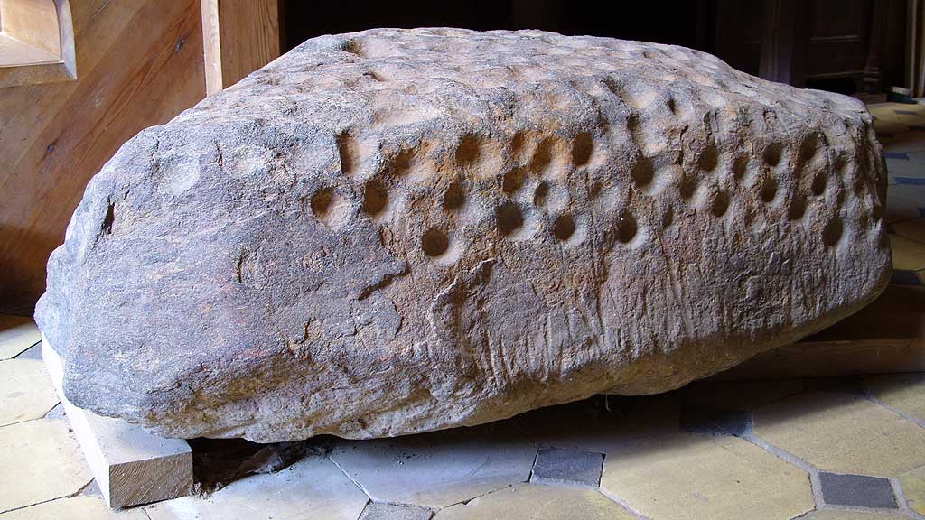 In the Monastery of Preetz, right there at the entrance of the church, there is
a fantastic stone with cup marks. 
Unfortunately, no further info.