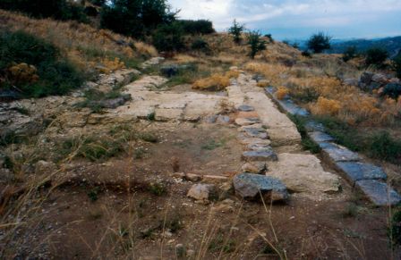 Ruins of the sanctuary of Apollo. Dates to 5th and 6th century BC. The site consists of a temple, stoa, large cistern and the oracular spring. Many blocks from the sanctuary were removed for the construction of Saint George church.