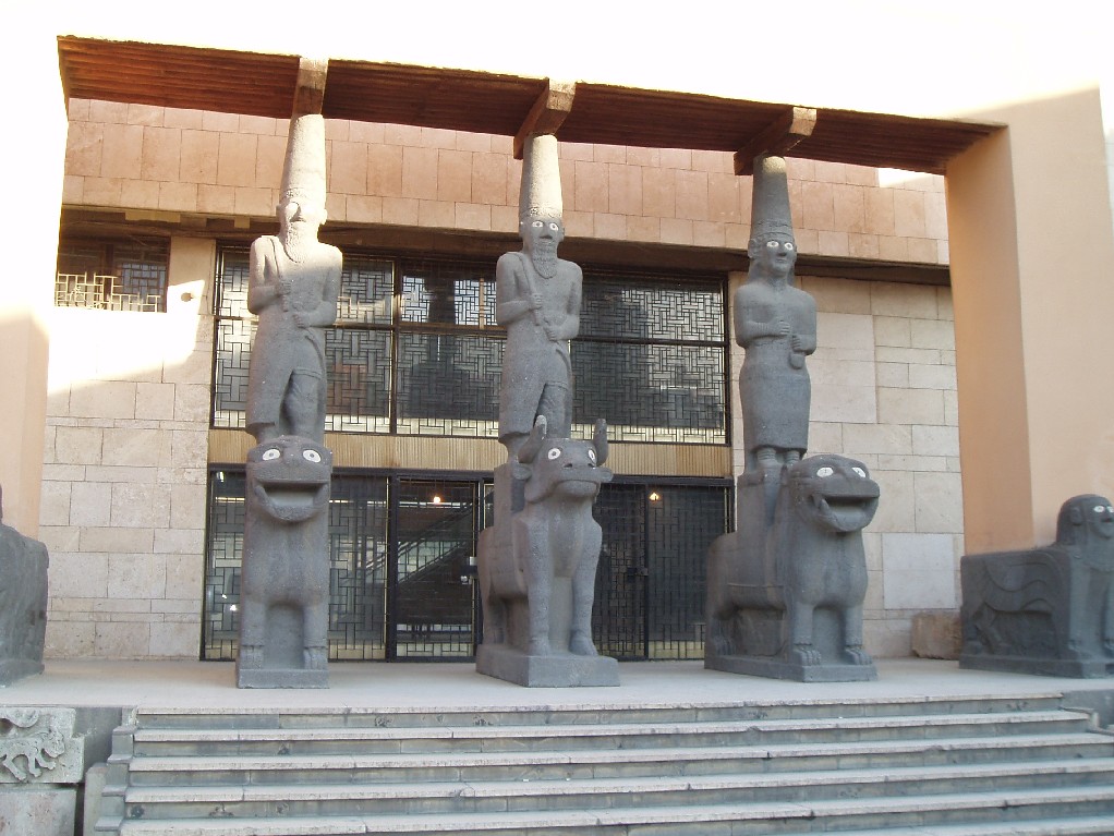 Archeology Museum in Aleppo. The Basalt Statues on the front are copies of statues found at Tell Halaf by baron Von Oppenheim. The originals, taken to a Berlin Museum after WWI, where unfortunately very heavily damaged during the WWII bombings of the german capital.
The Aleppo museum tends to specialise on sattues and other large stone items. The museum is however currently being renovated, which