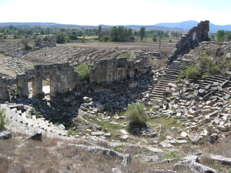 The ruined theatre with the stadium behind.