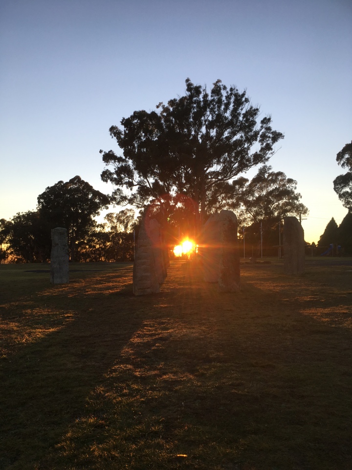 The rising winter solstice sun through the standing stones in Glen Innes 2017