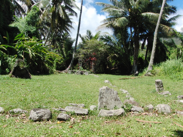 Cook Islands. Stone perimeter of the Marae, with the standing stone in the background.

Nov 2011.