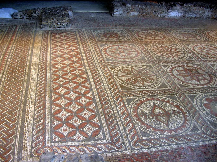 This perfect mosaic floor situated above the hypocaust is in the centre of Verulam Park.  Today it is protected by a free-standing shelter  with a raised walkway to give the best view.  It is uncanny to walk through the extensive park, knowing that beneath your feet is a whole Roman city.- one of the most important in Britannia.