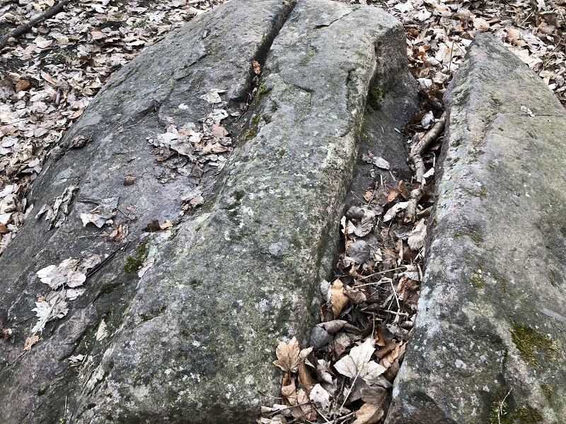 A close up of the two large markings on the possible capstone. These markings are from modern times and are believed to be from when people were trying to destroy the stone for building material. 