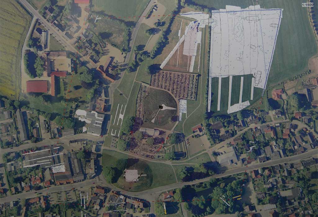 A huge ship-shaped stone circle.

This is a map that is currently shown in the lobby of the Kongernes Jelling Museum.

The length of the construction exceeds 350m.

Also note the several rectangular stone settings in the big white area... look like Long Barrows to me.



