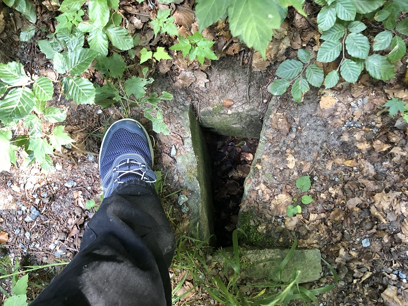 Placed my foot in this picture to show the size of the cist compared to my foot. It's quite a small cist. 
