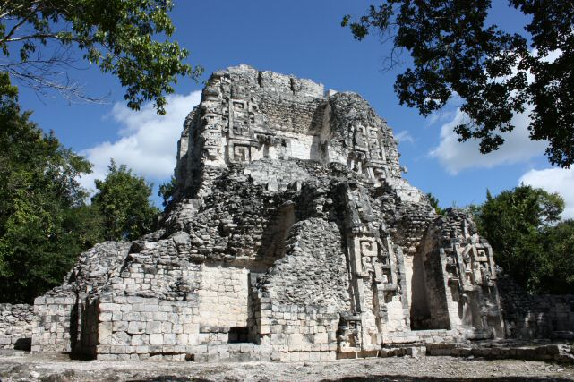Structure XX - this is the highest building at Chicanná, its layout is almost quadrangular, composed of two levels and oriented towards the cardinal points.  The lower section has eleven rooms and the upper part four.  The principal facade is on the south side.
The facade of the upper temple preserves the remains of the typical motif of the Chenes region: a complete, gigantic, zoomorphic mask.  