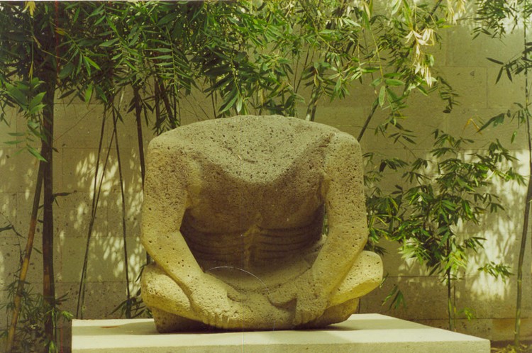Headless sculpture from Late Post-Classic period (1200 - 1521 AD) located on patio of the museum, probably it has been damaged during christianization of Mexico (photo taken on March 2002).