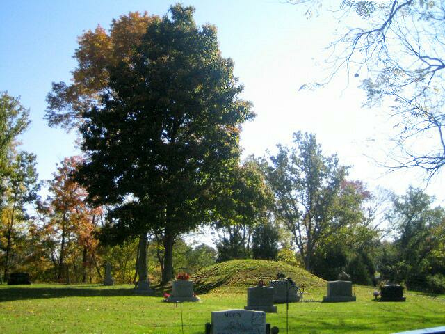 The villagers of Reily, Ohio placed their own cemetery around this prehistoric Indian mound.  This use of mound sites for European-American burials was common in the Midwest, settled in the 1820's to 1840's.  
