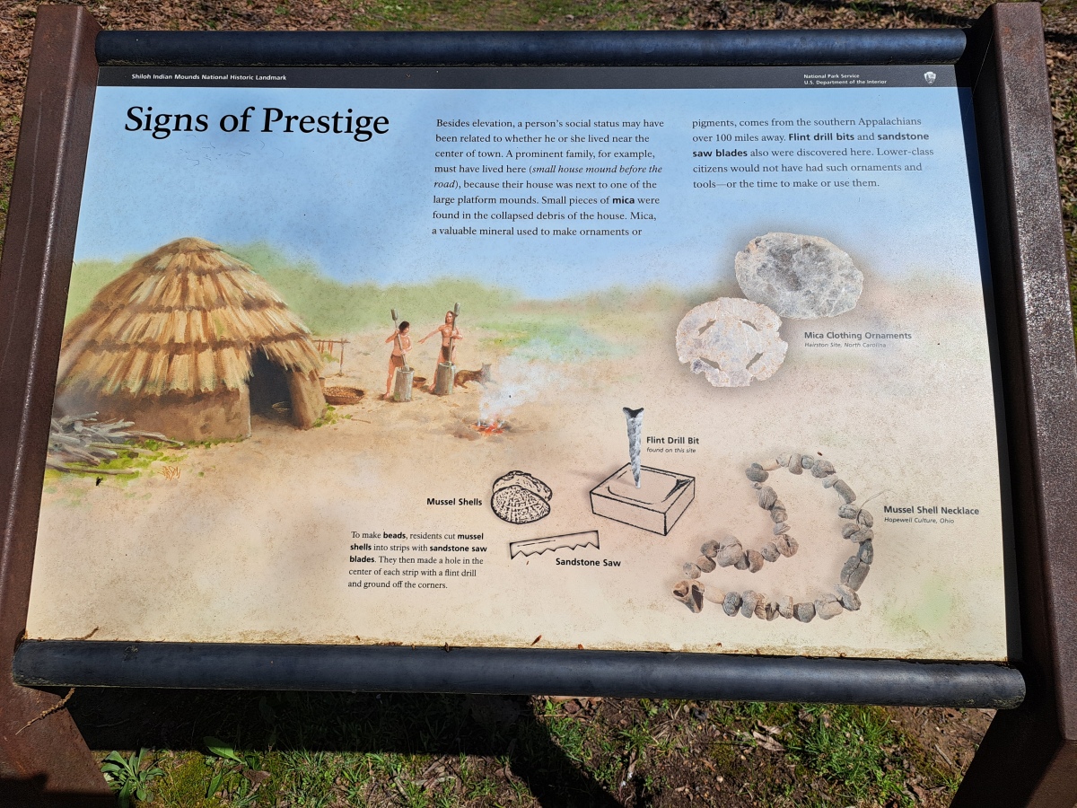 Information board with a description of the signs of social stratification in the complex. Such as proximity of a house to a platform mound and the 