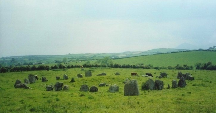 Ballynoe stone circle with the mountains in the background on the right.