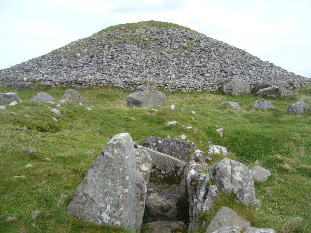 Cairn S: Looking from the chamber out across the kerbstone ring towards Cairn T.  October 2008.