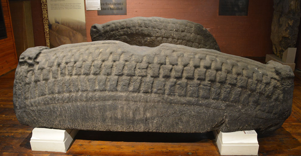 The large and impressive Govan 11, which is dated to the late tenth century.  Also recorded as Canmore 353180, the concave portion of the back is thought to have been created by sharpening blades along the top (though probably to have been scythes used to cut the graveyard).