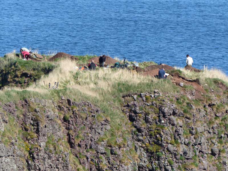 This close-up photograph of the summit of the Dunnicaer Sea Stack shows the extent of the archaeological excavations.