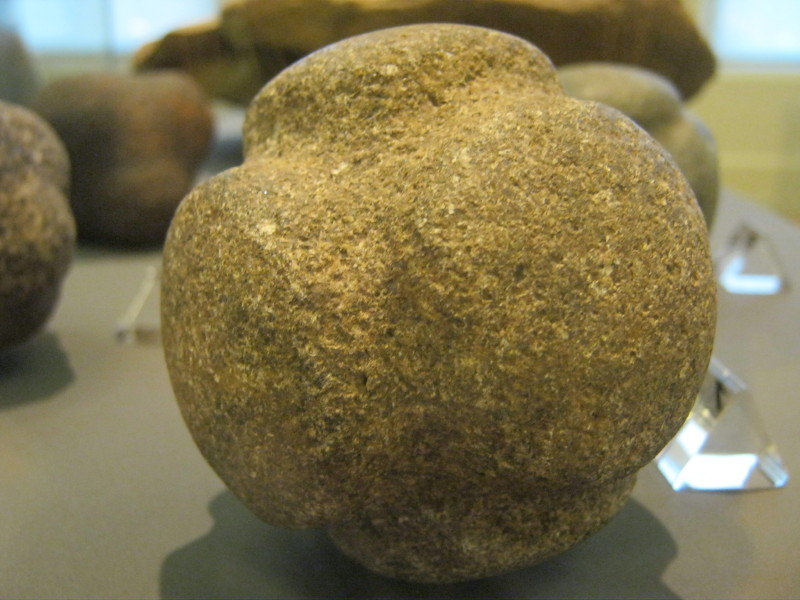 A carved diorite stone ball with six projecting disks found at St Fort sand and gravel quarry, Wormit, Fife.  Some 425 of these carved stone balls have been found in Scotland and are tentatively dated to the Early Bronze Age around 3500 to 5500 years ago.  Their use is enigmatic.  Similar stones have been found in other parts of the British Isles.  September 2012. 