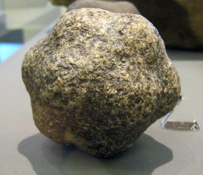A carved stone ball with 14 small knobs.  Bog find from Dyce, Aberdeenshire.  Some 425 of these carved stone balls have been found in Scotland and are tentatively dated to the Early Bronze Age around 3500 to 5500 years ago.  Their use is enigmatic.  Similar stones have been found in other parts of the British Isles.  September 2012.