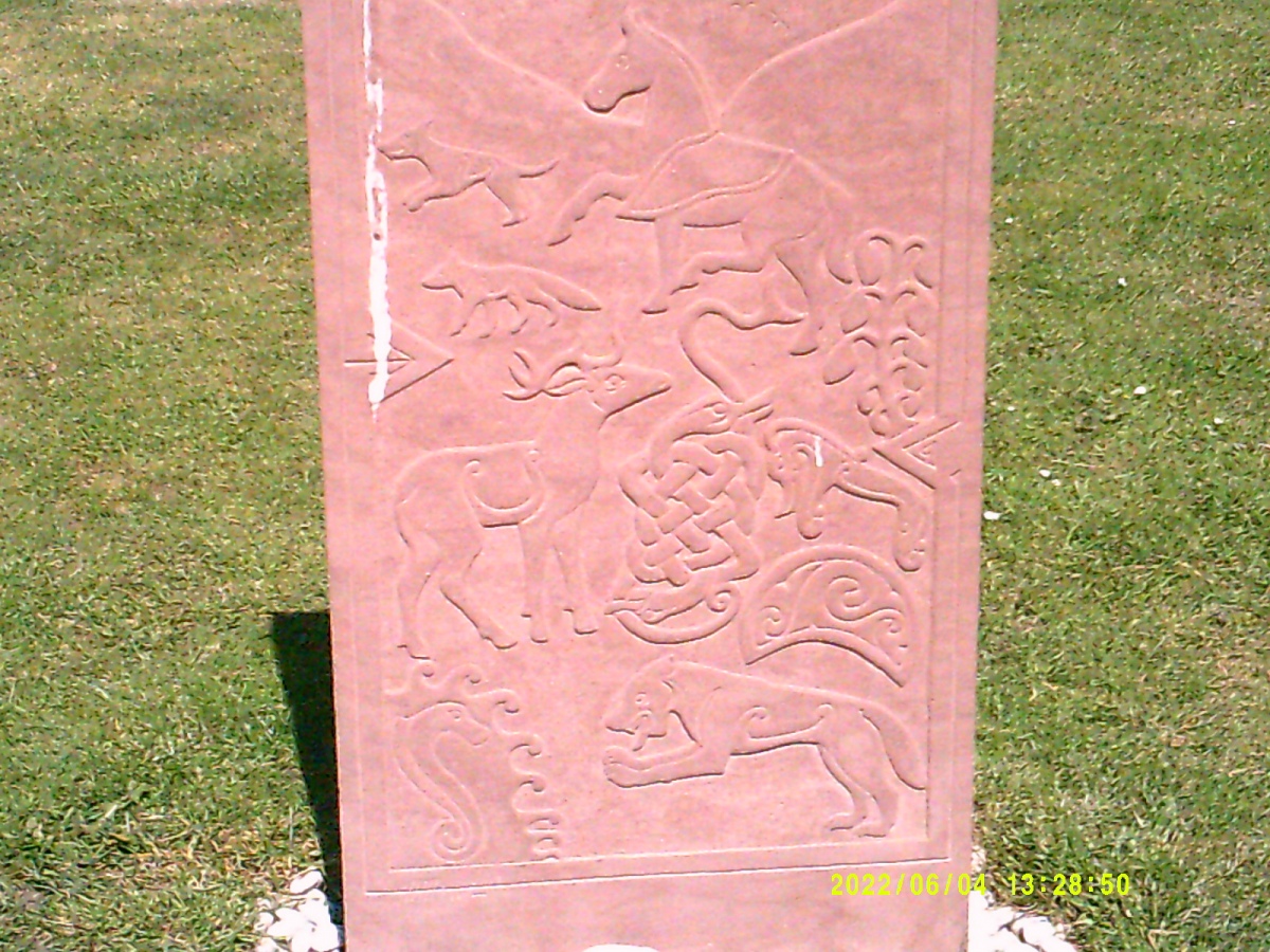 Modern Pictish Stone erected on green across from the Church. Other side has Celtic Cross