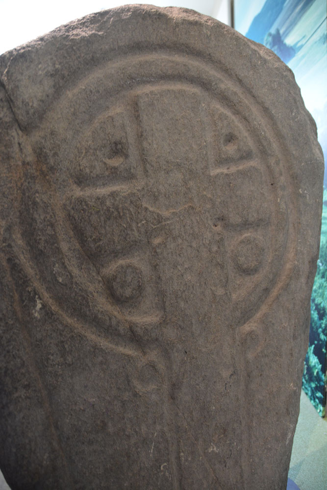 Side 1 of the Achadh na Cille stone cross from Oibmore, Knapdale. Recorded as Canmore ID 319858, the museum sign tells us 
