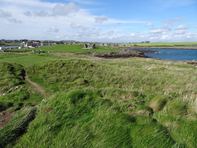View from the earthworks of Isle Head fort towards St. Ninian's Chapel (photo taken on September 2016).
