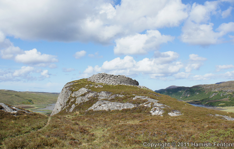  Dun Mhaigh viewed from the south, the broch sits on to of a rocky knoll on the ridge, the ridge rises again behind and to the left of the photographer.

13 May 2011