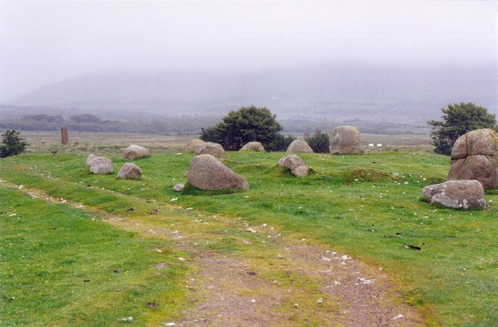 Machrie Moor 5, beside the track to the main circles of Machrie Moor.  In the left background can be seen the single remaining pillar of Machrie Moor 3.
June 2002, in the mist!