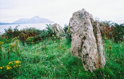 Largybeg Point standing stones, Holy island is in the background.