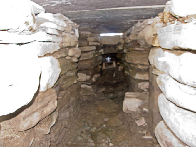 Looking along central passage from far right chamber to E chamber.