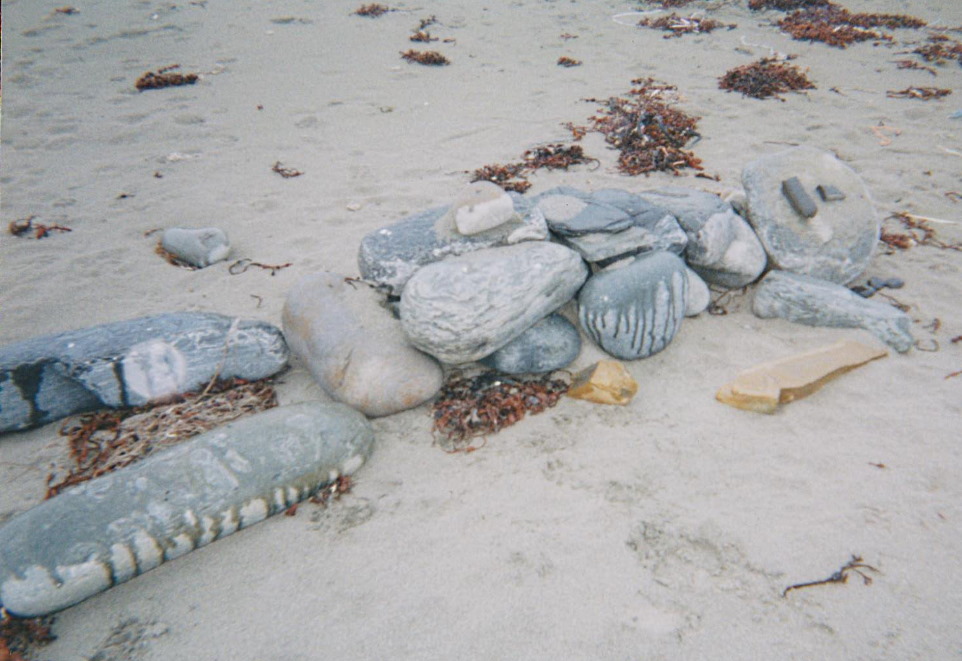 TAlanJones: This is the stone man I found lying on Skaill Bay beach back in 2001.  (I'd left a comment about him on your recent photo of the stone towers visitors are making these days.)
