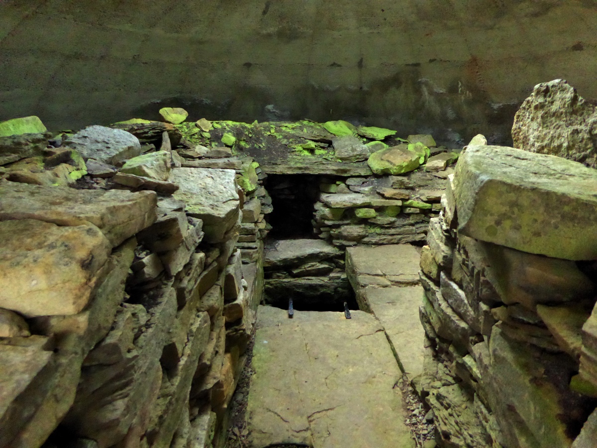 Inside the upper chamber of the main cairn.  The metal bits are the ladder down to the lower chamber...

June 2016