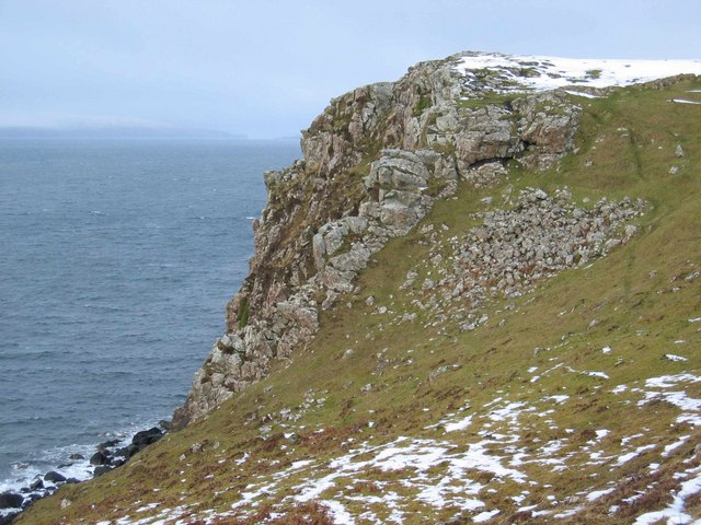 A fort on the east shore of Loch Snizort Beag. Part of the remains of a defensive wall can be seen near the skyline. The stones on the slope were once part of the construction. A wonderful natural defensive position.

Copyright John Allan and licensed for reuse under the Creative Commons Licence.

