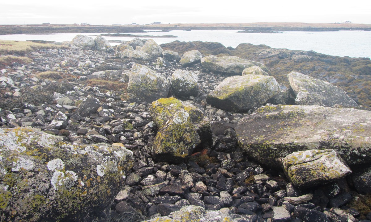Peripheral stones and cairn material - on the northern (eroded) portion of the site