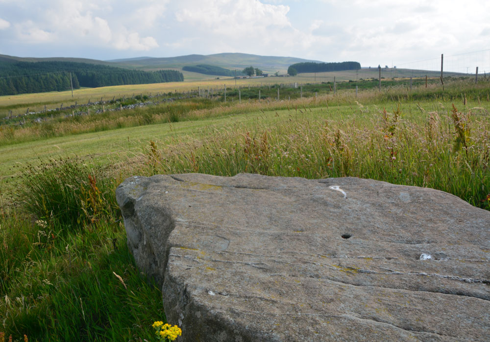 Standing on top of the mound, in the middle of the stone, looking at the views to the south/south east.