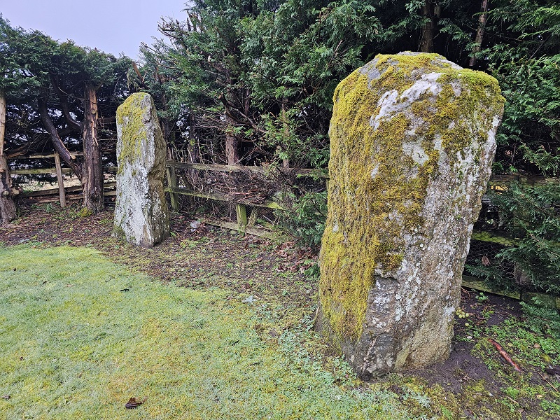 Sometimes before 1975 one of the stone was hit and broken by the bus.