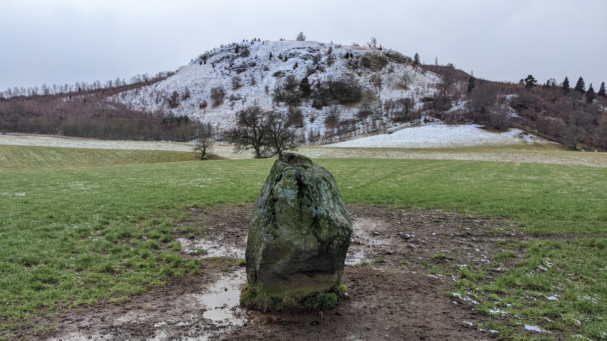 The Witches' Stone at Monzie, looking south over the stone towards Kate McNieven's Crag