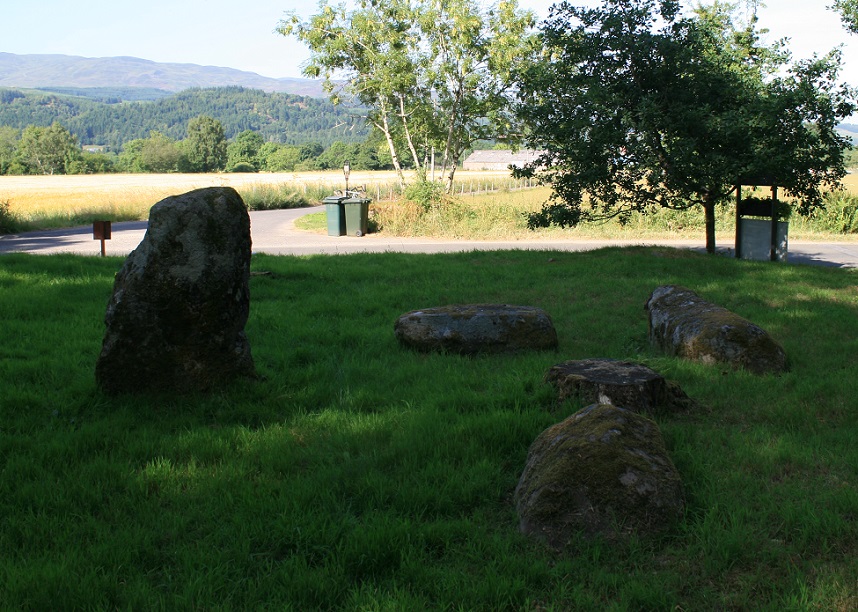 Four stones and one tree stump.